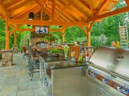 This hill country home has several outdoor living spaces including this outdoor kitchen hangout. Outdoor Kitchens And Bars Hgtv