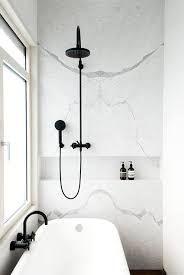 Classic homes can also benefit from matte black bathroom fixtures, with black shower frames and fixtures offering a heritage feel to traditional properties. Marble Trends Matte Black Fixtures White Marble The Davani Group