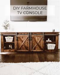 Two sliding doors for hidden storage. Diy Farmhouse Tv Console With Sliding Barn Doors Crafted By The Hunts