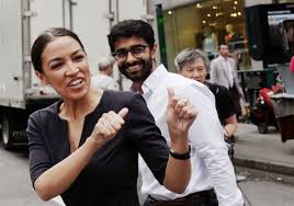She is a member of the democratic socialists of america and justice democrats. Liberal Activist Alexandria Ocasio Cortez And Trump Celebrate After Tuesday S Primaries Pittsburgh Post Gazette