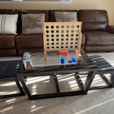 A little off the beaten path of what we've already seen, these seats don't break apart, but they do flip in to a tray/table. Kelton Coffee Table With Nesting Stools Ashley Furniture Homestore