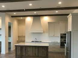 A contrast between gray kitchen cabinets and walls regulates the ambiance in the kitchen. Best Kitchen Cabinet Color Paints