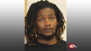 One man wanted, another man arrested following assault