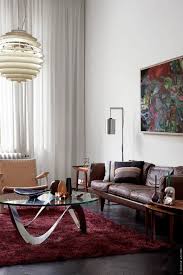The base of this table is crafted from metal and features a complementary gold finish. 29 Chic Glass Coffee Tables That Catch An Eye Digsdigs