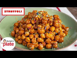 A favorite holiday treat, authentic struffoli recipe calls for frying dough balls, drizzling them with honey, and topping them with colorful sprinkles. How To Make Struffoli Honey Balls Struffoli Recipe Youtube