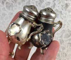 Original floral pattern depression glass, also known as poinsettia, was made by the jeannette glass company, ca. Vintage Silver Toned Metal Footed Miniature Teapots Salt And Pepper Shakers Dispenser