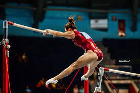 Her series of intricate connections — all done with a fluidity and grace that makes it look effortless — are among the most difficult in the sport. Uneven Bars Female Gymnast To Competition In Artistic Gymnastics Female Gymnast Uneven Bars Gymnastics Flexibility