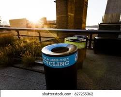 Image of New York City skyline with a recycling bin in the foreground