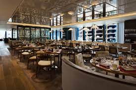 Dining room sets dining room design dining room chairs best interior design interior design the langham, london is a five star luxury hotel with 380 guestrooms and suites, 15 function rooms. Gallery Of Mediating Mies Dirk Lohan S Langham Hotel Lobby At The Ibm Building 7