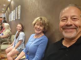 Nurse Cindy and Rosette torturing me with wall sits. I only cried  twice...OK, three times tops.