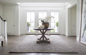 Find area rugs at wayfair & enjoy free shipping on over 10,000 area rugs and throw rugs in every size. Round Trestle Entry Table With Gray Jute Rug Transitional Entrance Foyer