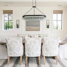 A couple of wall sconces on either side of the painting boost illumination when needed. Dining Room Mirrored Wall Sconces Design Ideas