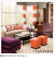 Orange living room with pastel purple sofa, fluffy white beanbags, round wooden center table. Orange And Purple Home Decor Novocom Top