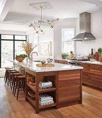 A breakfast counter wrapped in walnut and whiteonwhite's saddle barstools abut the island. Top 10 Best House Home Kitchens Of 2015 Home Kitchens Home Decor Kitchen Kitchen Remodel