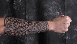 It's a battle scene between a knight in armor with a sword and a shield bravely slaying a winged dragon. Celtic Sleeves Tattoo Armor And Full Knotwork Coverage Tattoos Luckyfish Inc And Tattoo Santa Barbara