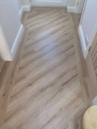 A Luxury Vinyl Tile With An Inlaid Border Stunning Effect Flooring Flooring Trends Vinyl Tile Flooring