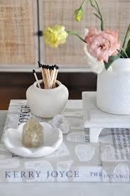 In this example, the coffee table provides quite a large storage space for a wicker basket, books and throw pillows. Our Favorite Coffee Table Books How To Style Them Modsy Blog
