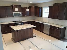 This fresh, contemporary kitchen remodel features luna pearl granite countertops, stainless steel accents, and a grey marble backsplash. Top 25 Best White Granite Colors For Kitchen Countertops Homeluf Com