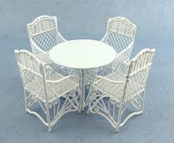Fully welded, powder coated wrought iron frames provide both strength and longevity and are finished with an exclusive 5 step finish to ensure color fastness and durability. Dolls House Garden Furniture White Wrought Iron Patio Set Table 4 Chairs Amazon Co Uk Garden Outdoors