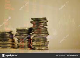 Double Exposure Of Coin Stack With Stock Market Screen Chart