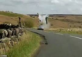 Motorcyclist Flies Through The Air After Collision With A Car On The Wrong Side Of The Road