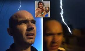 Byron Bay backpacker films lightning strike just over his shoulder