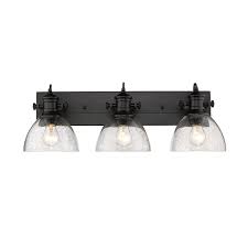 Use daylight temperature bulbs for bathroom vanity task lighting to ensure the most accurate depiction of color while performing personal hygiene and grooming tasks. Golden Lighting Hines 3 Light Bath Vanity Light With Glass Black Rona