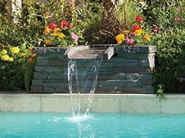 Pool Fountains Add A Decorative Touch And The Soothing Effects Pool Water Features Pool Waterfall Backyard Pool Landscaping