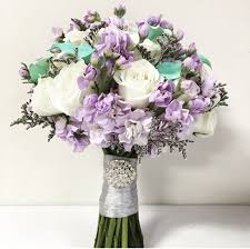 Lavender doesn't boast big, blooming petals, but it still has plenty to offer for your wedding. Lavender And Aqua Wedding Flowers And Bridal Bouquet Aqua Wedding Flowers Lavender Wedding Decorations Lavender Wedding Flowers