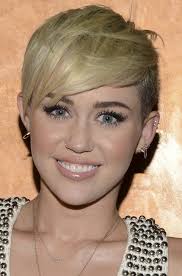 Miley cyrus curly ponytail hairstyle 30 Miley Cyrus Hairstyles Pretty Designs Short Punk Hair Miley Cyrus Hair Blonde Pixie Hair