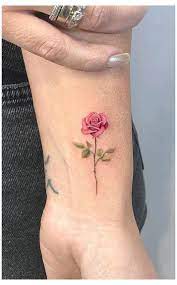 Pink rose dainty hand tattoo. Boho Bathroom Oasis Homedecor Rose Tattoos On Wrist Pink Rose Tattoos Tiny Rose Tattoos