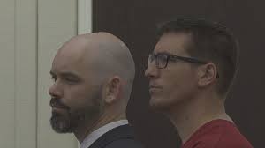 Joel Searby faces twelve charges of owning child porn