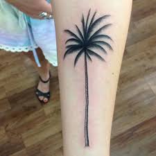 One more fresh idea is to ink a realistic hourglass tattoo with trees of life inside on your arm. Beautiful Palm Tree Tattoo On Girl Left Forearm