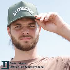 Our newest Maverick, Carter Mazur, debuting our forest green hat. Michigan  born @carter_mazur grew up chasing his dream of playing professional  hockey. He helped University of Denver win the National Championship and