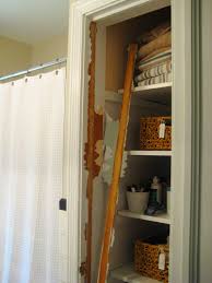 Take The Door Off Your Bathroom Linen Closet For A Chic And Open Feeling