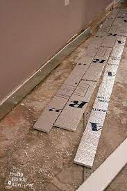 Tools and materials to level a concrete slab. How To Patch And Level A Concrete Subfloor Pretty Handy Girl