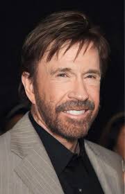 Chuck Norris doing warm up curls with 6 plates at 84 years old