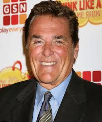 Sad to hear news of Chuck Woolery's passing. I remember catching reruns  when I was home sick and my young mind being blown realizing the original  Mr. Dingle was hosting Wheel Of
