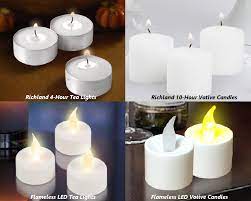 The frosted glass votive holders contain a poured white candle. Baby Shower Personalized Hurricane Candle Holders