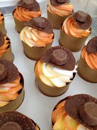 cupcakes 3 colours in pipping bag hats made of chocolate wafter from aldi in aus and cho indiana jones birthday party indiana jones party indiana jones cake