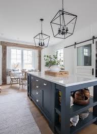 For starters, navy blue is a classic color that is both timeless and sophisticated. Navy Island White Kitchen The Lilypad Cottage