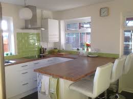 Finished Kitchen Wickes Houston With Colmar Oak Work Tops Ikea Lighting Bar Stools From Atlant Green Kitchen Designs Kitchen Bar Design Small Kitchen Tables