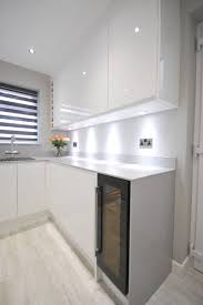 Sourced from leading manufacturers such as duropal, formica and bushboard these laminate gloss worktops are timeless and on trend with the ability to reflect light, making your kitchen look bigger. White Gloss J Pull Contemporary Kitchen With Light Grey Quartz Worktop Modern Kitchen Other By Lords Houzz