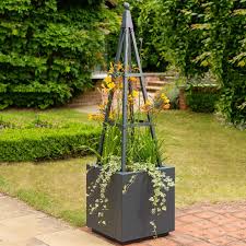 These obelisks range from small garden obelisk up to super size jumbo obelisks ideal for any size these plant supports are both practical and decorative and are made to last and look great in situ for. Harrod Obelisk Planter Harrod Horticultural