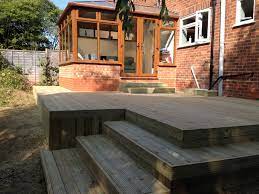 Small Decking Area Incorporating Steps Down To Lawn Area Decking Area Landscape Projects Deck Design
