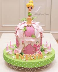Refer to the second tinkerbell cake picture below for the outline. This Beautiful Tinkerbell Cake Is Sure To Be Any Girl S Birthday Wish Come True Whitecremecakes Tinkerbell Cake Fairy House Cake 1st Birthday Cakes