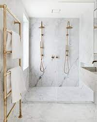 The Bold Look Of Slab Marble The Identite Collective Bathroom Interior Design Top Bathroom Design Marble And Brass Bathroom