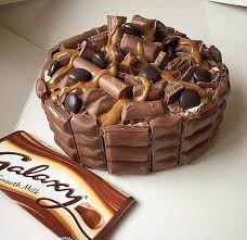The logos on this cake were hand cut then hand painted. 38 Galaxy Ideas Galaxy Chocolate Galaxy Chocolate