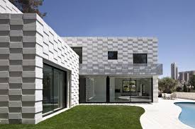 While applying plaster is a highly technical process that is usually best left to professionals, any homeowner can do it both plaster and spackle are indoor products and cannot be used outside because they rot with moisture. Barud House Paritzki Liani Architects