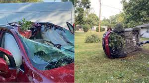 Officials: Woman dies after wheel breaks off truck, crashes through her car's windshield, roof